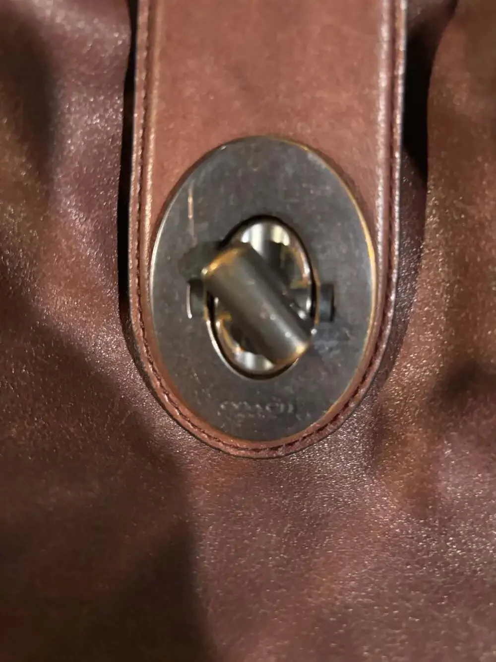 Coach Brown Leather Hobo Shoulder Bag with Grommets and Turnlock Closure